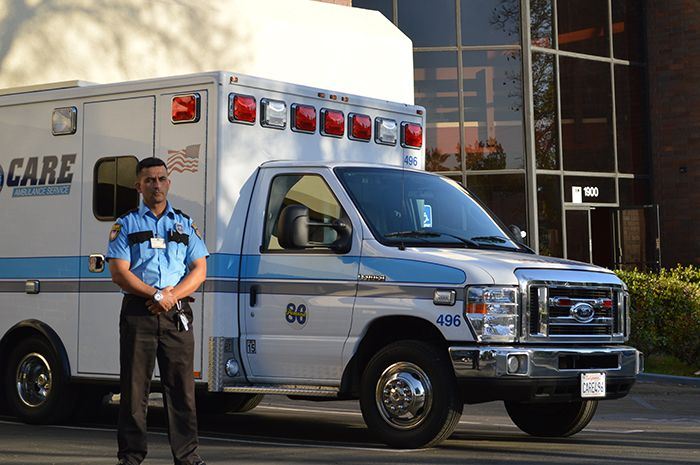 Image of Security guard standing near ambulance, Mobile Patrol Security, Allied Nationwide Security
