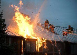 Image of a fire on top of a house, Security Guard Blog, Allied Nationwide Security